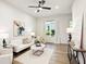 Bright living room with hardwood floors, white sofa, and neutral decor at 321 Dilbeck Ne Cir, Atlanta, GA 30342