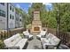 Inviting outdoor space featuring a brick fireplace with comfortable seating, perfect for relaxation and entertainment at 321 Dilbeck Ne Cir, Atlanta, GA 30342