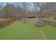 Expansive backyard with well-maintained lawn, bordered by wooden and wrought iron fencing at 4165 Azurite St, Cumming, GA 30040