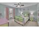 Colorful bedroom featuring a ceiling fan, carpet floor and nice decor at 4165 Azurite St, Cumming, GA 30040