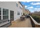 Outdoor deck with a grill, dining table, and bench offering a relaxing space at 4165 Azurite St, Cumming, GA 30040