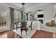 Bright dining area with hardwood floors, white trim, and views of the backyard at 4165 Azurite St, Cumming, GA 30040