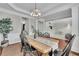 Another angle of the dining room with decorative lighting and a view into the play room at 4165 Azurite St, Cumming, GA 30040