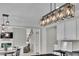 A modern kitchen featuring an island with barstool seating and stylish pendant lighting at 4165 Azurite St, Cumming, GA 30040