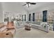 Bright and open living room seamlessly connected to the kitchen, perfect for modern living and entertaining at 4165 Azurite St, Cumming, GA 30040