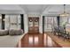 Open-concept living room featuring hardwood floors, recessed lighting, and ample natural light at 4165 Azurite St, Cumming, GA 30040