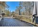 Home boasts a back deck with wooded view for entertaining and relaxing at 5890 Kayron Dr, Atlanta, GA 30328