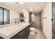 Bathroom features contemporary vanity, framed mirror, and tiled walk-in shower at 5890 Kayron Dr, Atlanta, GA 30328