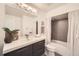 Stylish bathroom features large mirror, modern vanity, and shower over tub at 5890 Kayron Dr, Atlanta, GA 30328