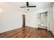 Hardwood bedroom with ceiling fan, closet, and plenty of natural light from windows at 5890 Kayron Dr, Atlanta, GA 30328