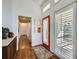 Bright foyer with hardwood floors, closet, and a glass door allowing natural light to flood the area at 5890 Kayron Dr, Atlanta, GA 30328