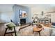 Open-concept living room seamlessly connects to the kitchen, featuring a fireplace, and comfortable seating at 5890 Kayron Dr, Atlanta, GA 30328