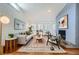Inviting living room with hardwood floors, decorative fireplace, ample seating, and natural light at 5890 Kayron Dr, Atlanta, GA 30328