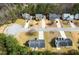 An aerial view of a neighborhood featuring manicured lawns and a cul-de-sac lined with beautiful single-Gathering homes at 6604 Destiny Se Dr, Mableton, GA 30126