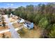 Aerial shot of a blue two-story home with a large backyard surrounded by trees in a suburban neighborhood at 6604 Destiny Se Dr, Mableton, GA 30126