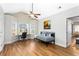 Bright bedroom featuring a ceiling fan, large window, and versatile daybed and desk setup at 6604 Destiny Se Dr, Mableton, GA 30126