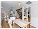 Dining area between the kitchen and living room, with a modern chandelier at 6604 Destiny Se Dr, Mableton, GA 30126