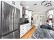 Contemporary kitchen with stainless steel appliances, gray countertops, white cabinets and adjacent access to backyard at 6604 Destiny Se Dr, Mableton, GA 30126