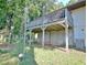 This backyard features an elevated deck, a playground, and a modern AC unit for comfortable outdoor living at 1453 Midview Dr, Decatur, GA 30032