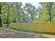 Newly installed wooden fence in the backyard of a wooded property for added privacy and security at 1453 Midview Dr, Decatur, GA 30032