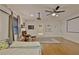 Finished basement area with projector, movie screen, ceiling fan, and an area for relaxing at 1453 Midview Dr, Decatur, GA 30032