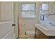 Bright bathroom with a modern sink, medicine cabinet and colorful shower curtain at 1453 Midview Dr, Decatur, GA 30032