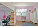 Bedroom with hardwood floors, light purple walls and a loft bed with desk at 1453 Midview Dr, Decatur, GA 30032