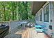 A spacious wooden deck with ample seating and a serene outdoor view at 1453 Midview Dr, Decatur, GA 30032