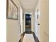 Hallway with hardwood flooring, neutral paint, and several entryways into separate rooms at 1453 Midview Dr, Decatur, GA 30032
