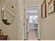 Hallway with light grey walls, white trim, hardwood floors and a view of a bedroom at 1453 Midview Dr, Decatur, GA 30032