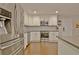 Updated kitchen with stainless steel appliances, white cabinets, and modern design at 1453 Midview Dr, Decatur, GA 30032