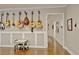 Living room showcasing a wall of guitars and a table set for  at 1453 Midview Dr, Decatur, GA 30032