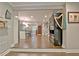 Bright living room with hardwood floors, large entry and view into the kitchen and dining area at 1453 Midview Dr, Decatur, GA 30032