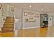 Open living room with recessed lighting, hardwood floors, and decorated walls and stairway at 1453 Midview Dr, Decatur, GA 30032