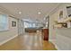 Spacious living room with wood floors, barn doors, a large sectional, and a decorative mirror at 1453 Midview Dr, Decatur, GA 30032