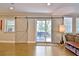 Living room with sliding barn doors leading to a spacious deck with a grill at 1453 Midview Dr, Decatur, GA 30032