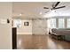 Open-concept living room with hardwood floors, barn doors, a cozy seating area, and natural light at 1453 Midview Dr, Decatur, GA 30032