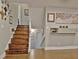 Bright entryway with a light gray wall and stained wood staircase that leads to the upper floor at 1453 Midview Dr, Decatur, GA 30032