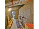 Unfinished basement featuring exposed ductwork, cinder block walls, and a door leading to another room at 1453 Midview Dr, Decatur, GA 30032
