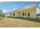 Exterior view of home with covered back patio overlooking the yard at 1471 Stephens View Dr, Loganville, GA 30052