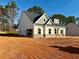 New construction featuring a mix of siding and brick accents, plus an attached garage at 1471 Stephens View Dr, Loganville, GA 30052