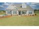 Charming single-story home featuring a well-manicured lawn and traditional architectural details at 1471 Stephens View Dr, Loganville, GA 30052