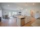 Bright kitchen with granite countertops, stainless steel appliances, and an island with seating at 1471 Stephens View Dr, Loganville, GA 30052