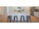 Kitchen island featuring seating for four, and stainless steel appliances at 1471 Stephens View Dr, Loganville, GA 30052