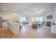 Open-concept layout with kitchen island, dining area, and comfortable living room at 1471 Stephens View Dr, Loganville, GA 30052