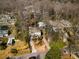 Aerial view of home and neighborhood in winter, featuring mature trees and greenery at 1828 Almeta Ne Ave, Atlanta, GA 30307