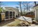 Landscaped backyard featuring a screened porch, patio, and detached garage at 1828 Almeta Ne Ave, Atlanta, GA 30307