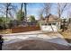Spacious backyard with a detached garage, brick wall, and paved area, perfect for outdoor activities at 1828 Almeta Ne Ave, Atlanta, GA 30307
