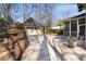 Backyard featuring a detached garage with a basketball hoop and a paved patio area at 1828 Almeta Ne Ave, Atlanta, GA 30307