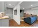 Basement view showcasing a stylish kitchenette with brick backsplash and an adjacent seating area at 1828 Almeta Ne Ave, Atlanta, GA 30307